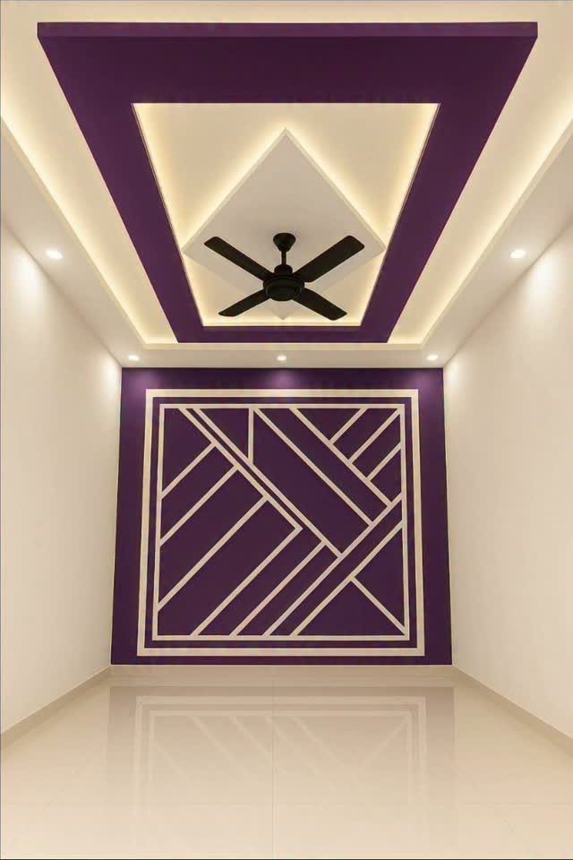 A purple accent wall with a large white geometric line pattern and a matching recessed ceiling design.