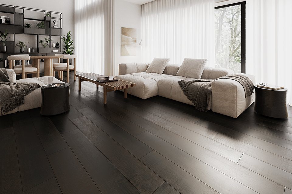 Dark espresso stained wood flooring in a modern, bright living room with cream furniture.