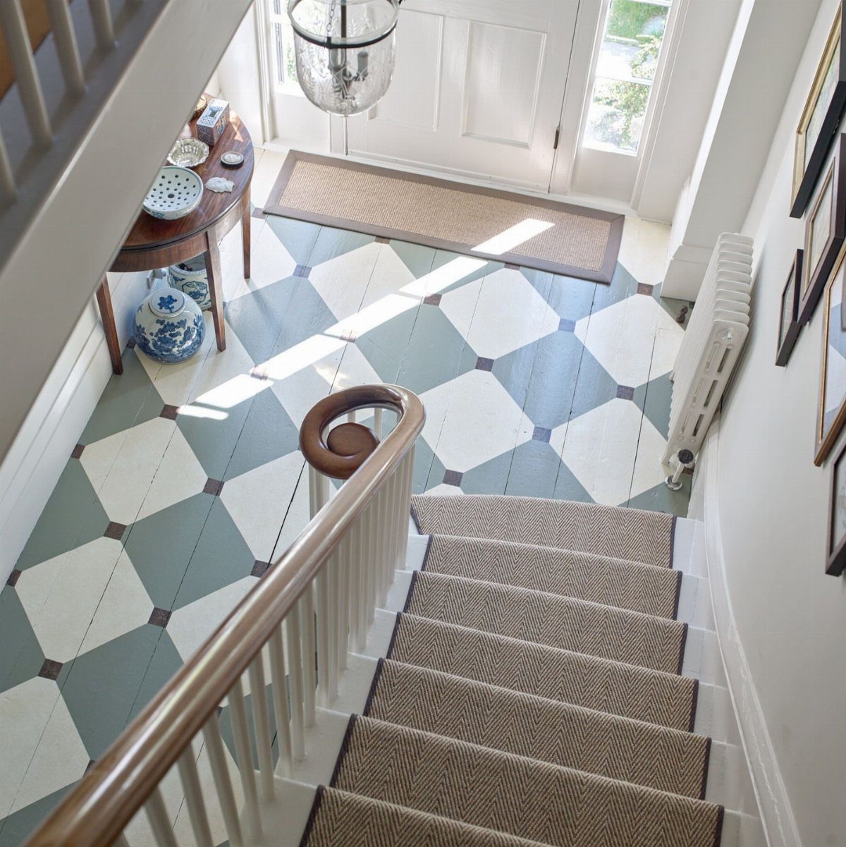 Orange Wood Floors: 4 Smart Style Ideas That Work 1 A checkerboard patterned floor in white and blue-grey tiles located in an entryway.
