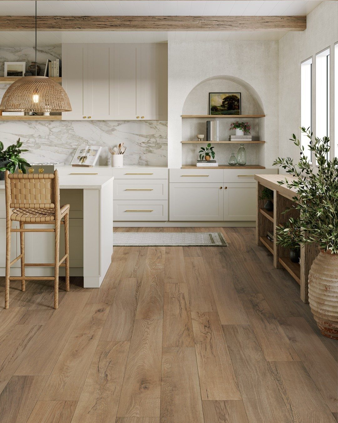 Light wood-look plank flooring in a bright, modern farmhouse style kitchen with white cabinets.