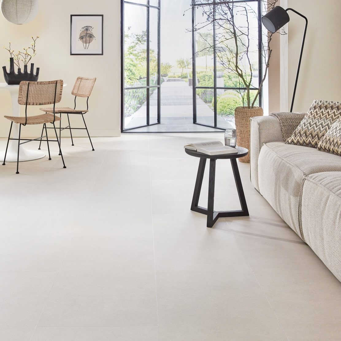 Light beige large format floor tiles in a bright, modern living room setting.